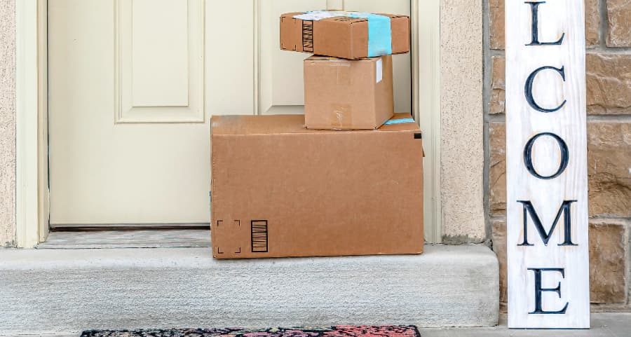 Boxes by the door of a residence with a welcome sign in Stockton